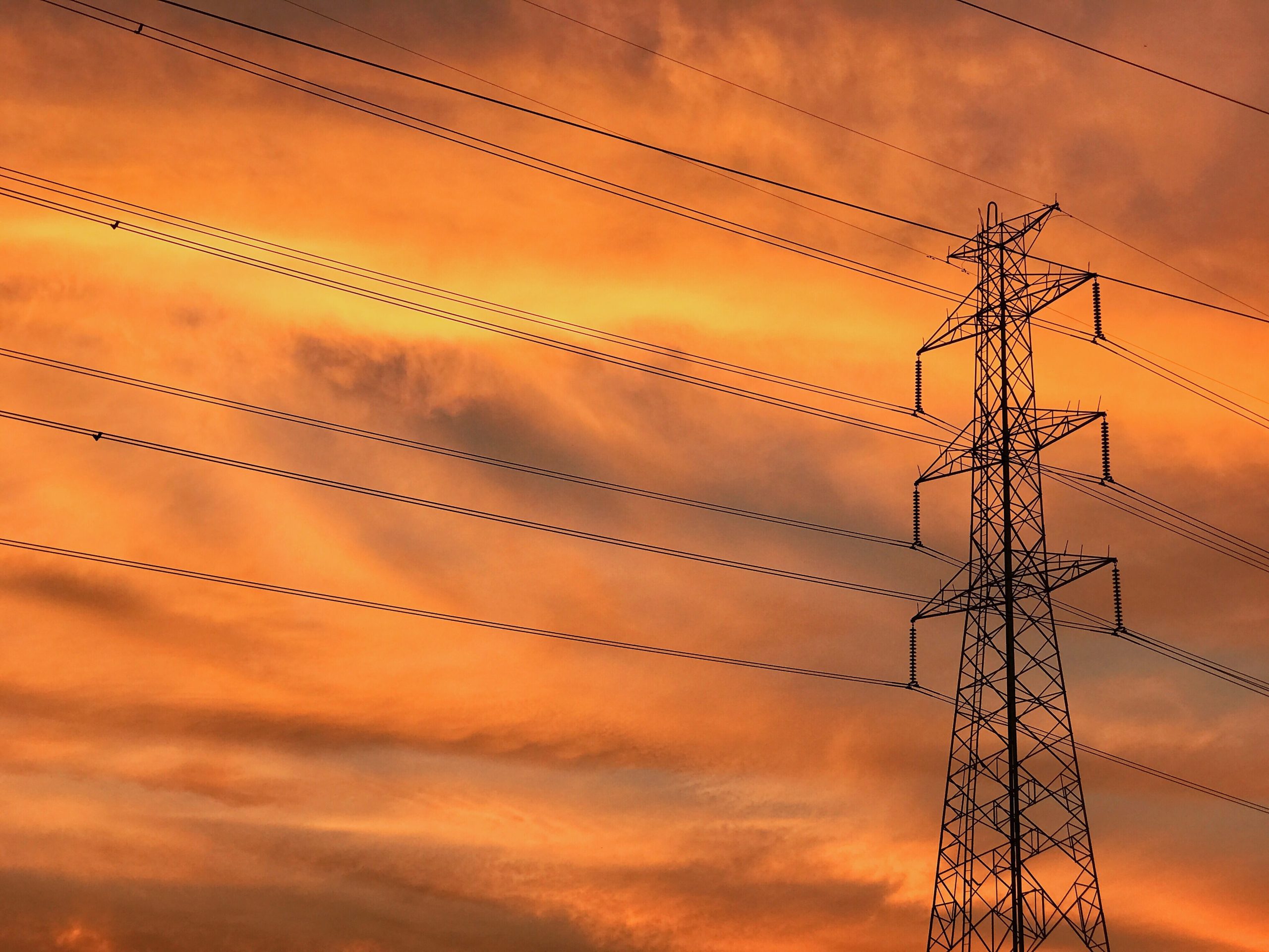 low-angle-view-electricity-pylon-sunset